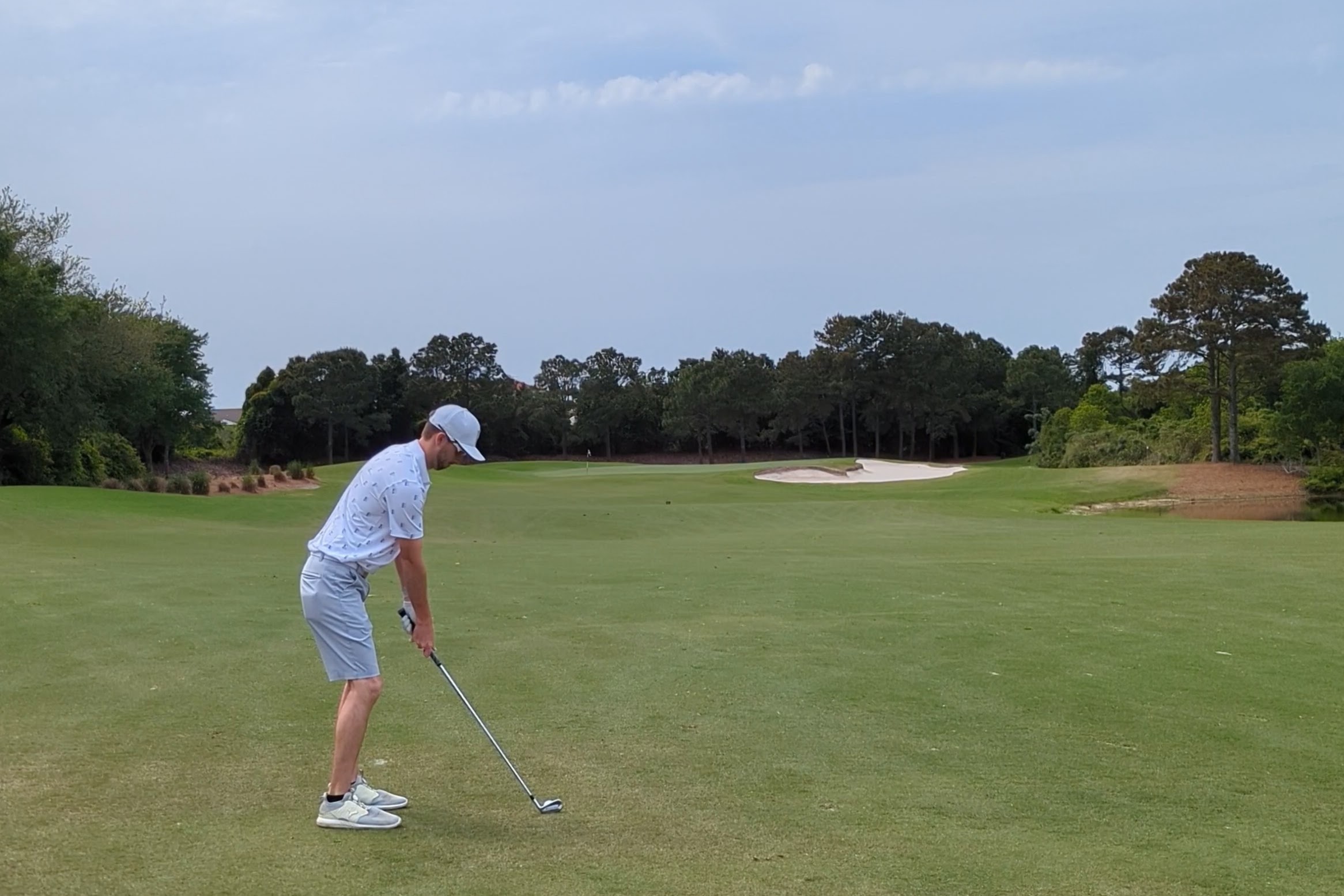 The approach shot at the fourteenth hole at Kelly Plantation Golf Club