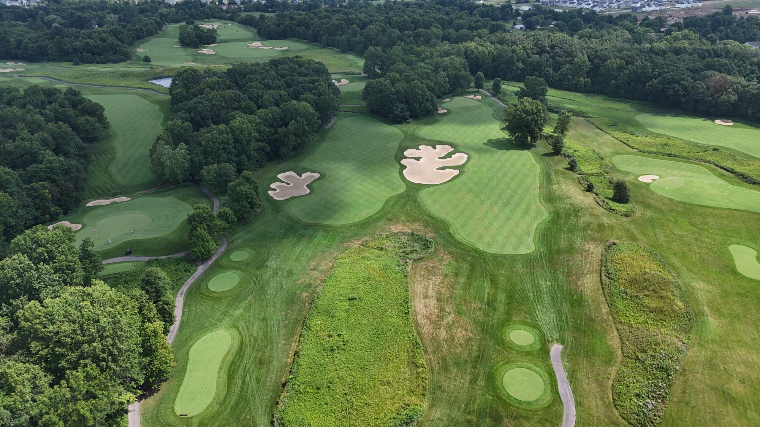The first hole (left) and the tenth hole (right) at Double Eagle Club.
